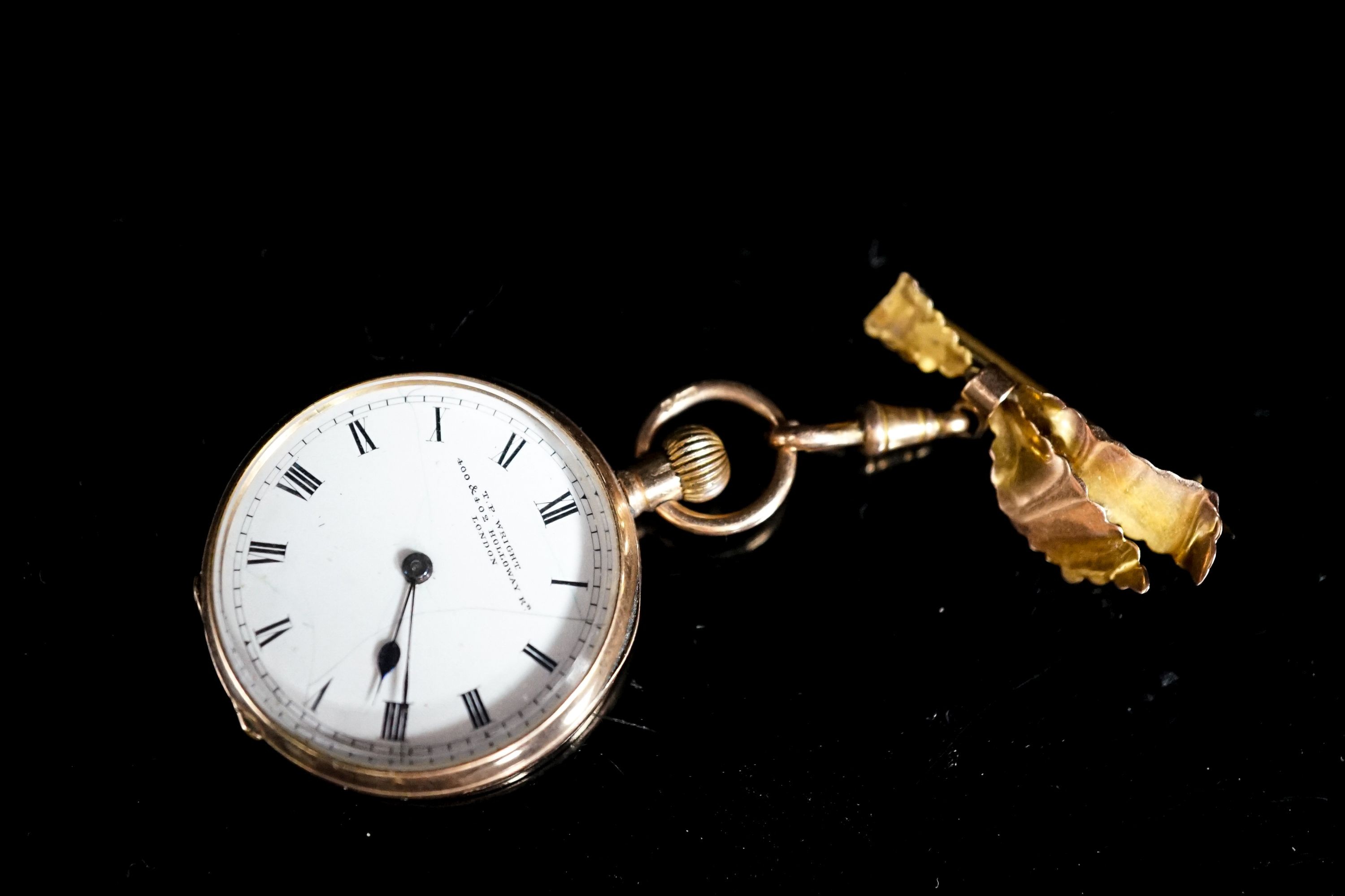 An early 20th century 9ct gold open faced fob watch, case diameter 30mm, on a 9ct suspension brooch, gross weight 26.4 grams.